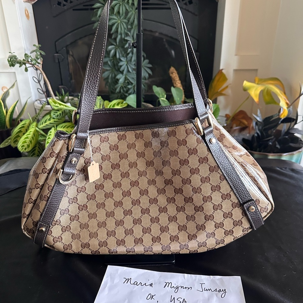 Brown Shoulder Bag with Signature Pattern in coated canvas